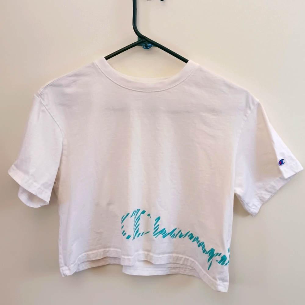 Cropped shirt. Champion bottom logo wrap around. Size Small. White and blue.